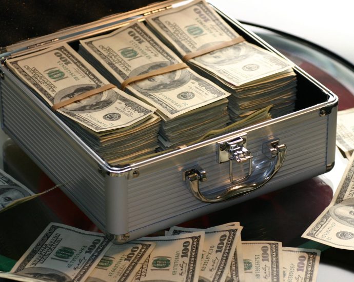 hard cash on a briefcase